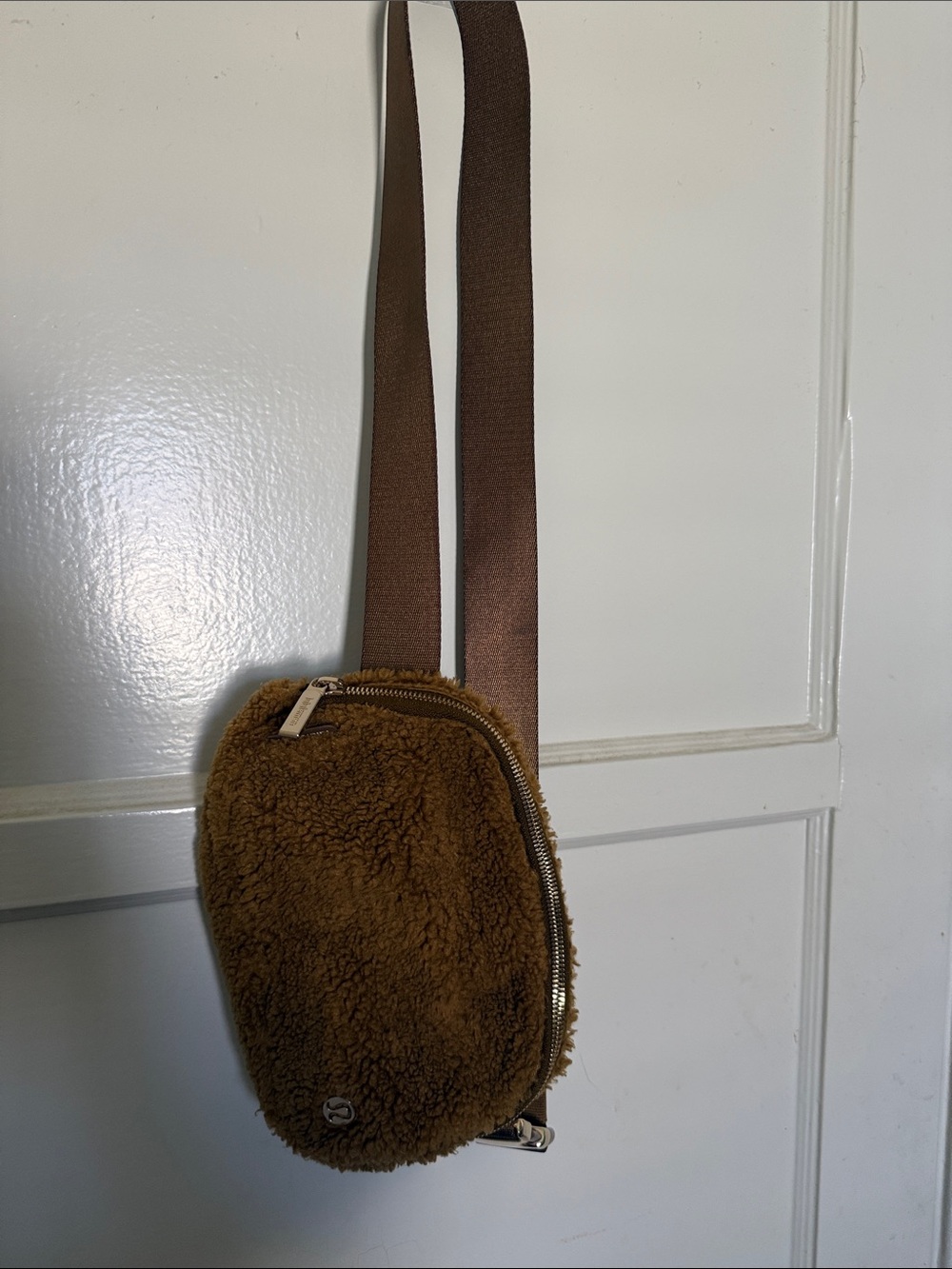 lululemon athletica tan shearling zipper pouch with gold hardware